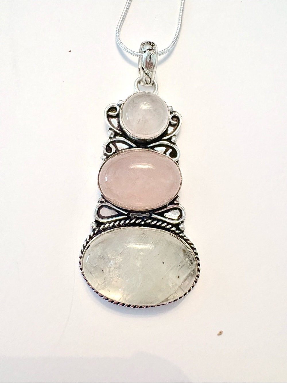 2 1/2 inch, 3 Rose Quartz, 925 marked pendant on a silver chain.